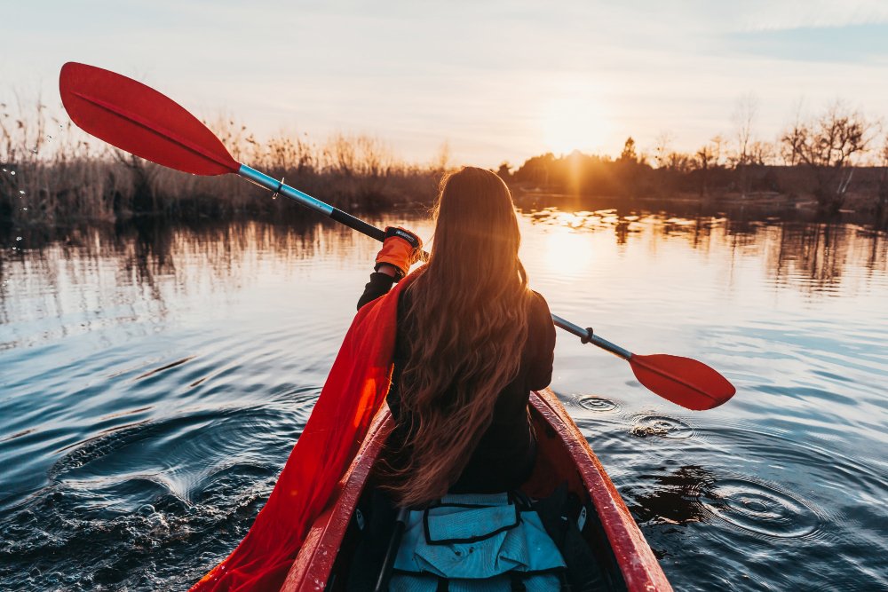 woman-holding-paddle-kayak-river